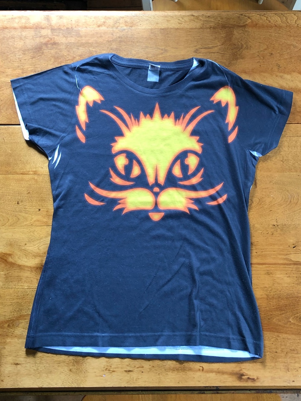 Women's Black Graphic Tee with Neon Orange & Yellow Print Cat Face